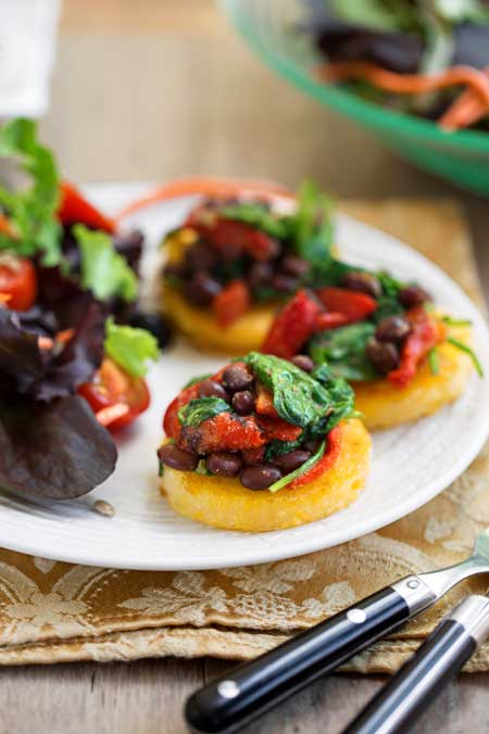 Polenta with Black Beans & Spinach, recipe by Nava Atlas, photo by Hannah Kaminsky